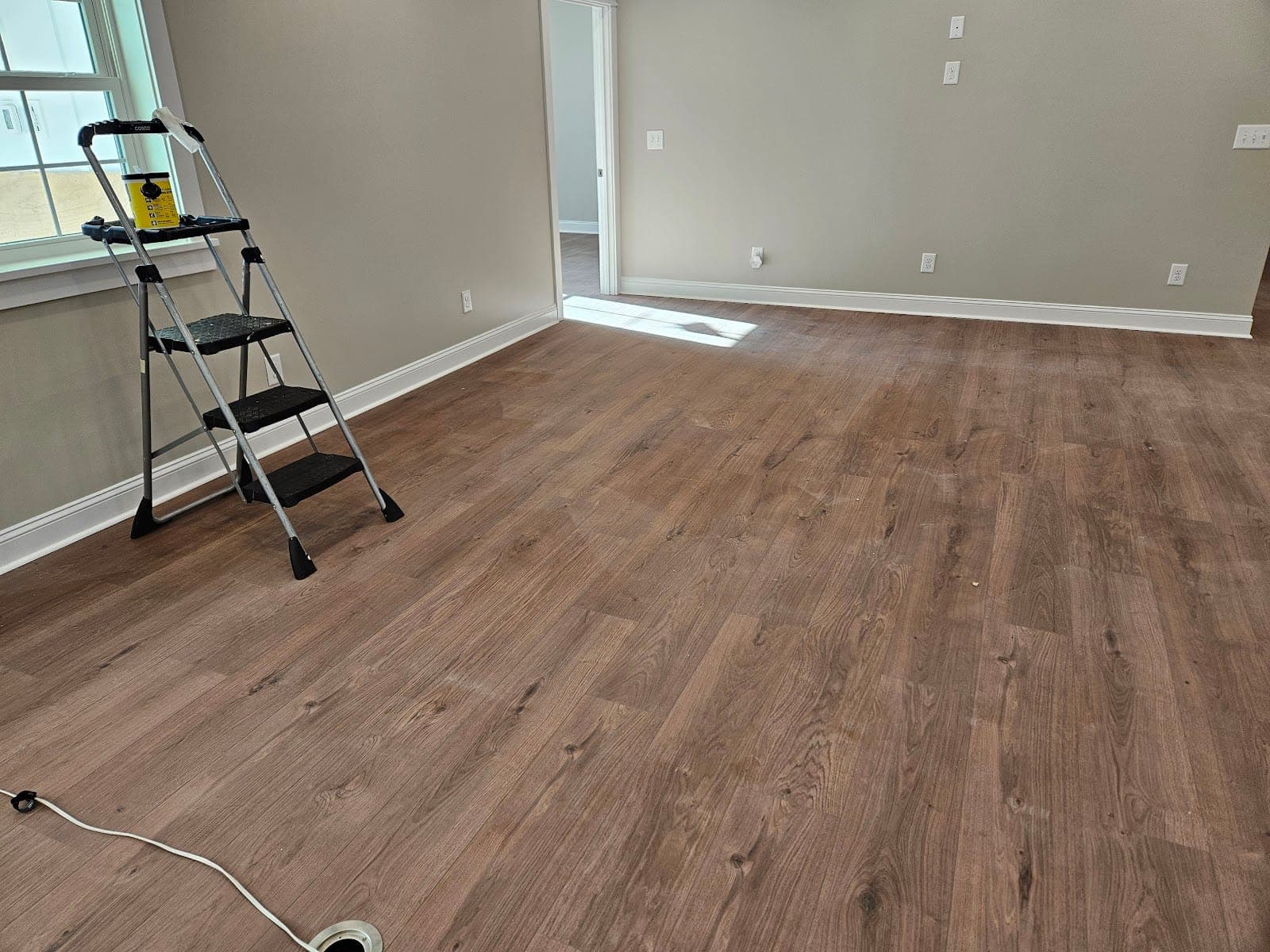 Room with wood-look flooring, freshly cleaned and ready for the next step